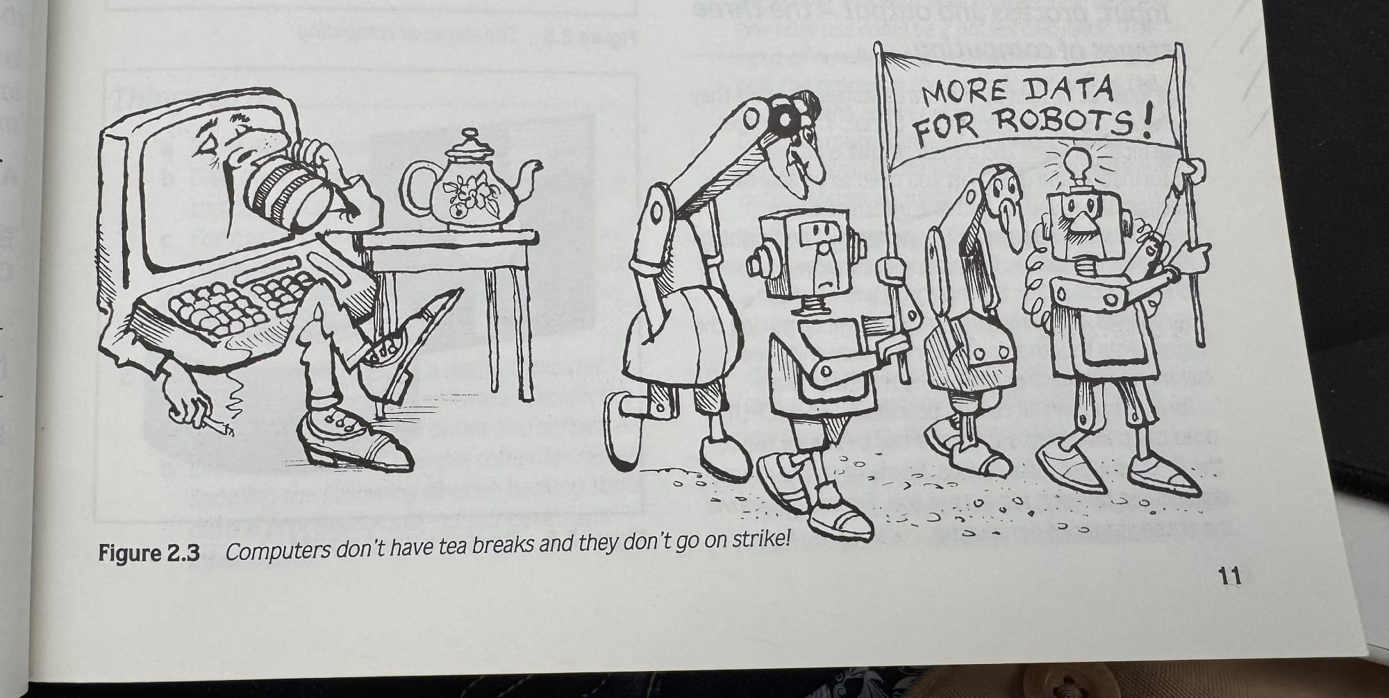 Figure 2.3 An illustration of a computer with arms and legs kicking back and drinking tea, and then a group of robots who look like they are on strike holding a sign that says “More data for robots!”.

The photo description reads “Computers don’t have tea breaks and they don’t go on strike."