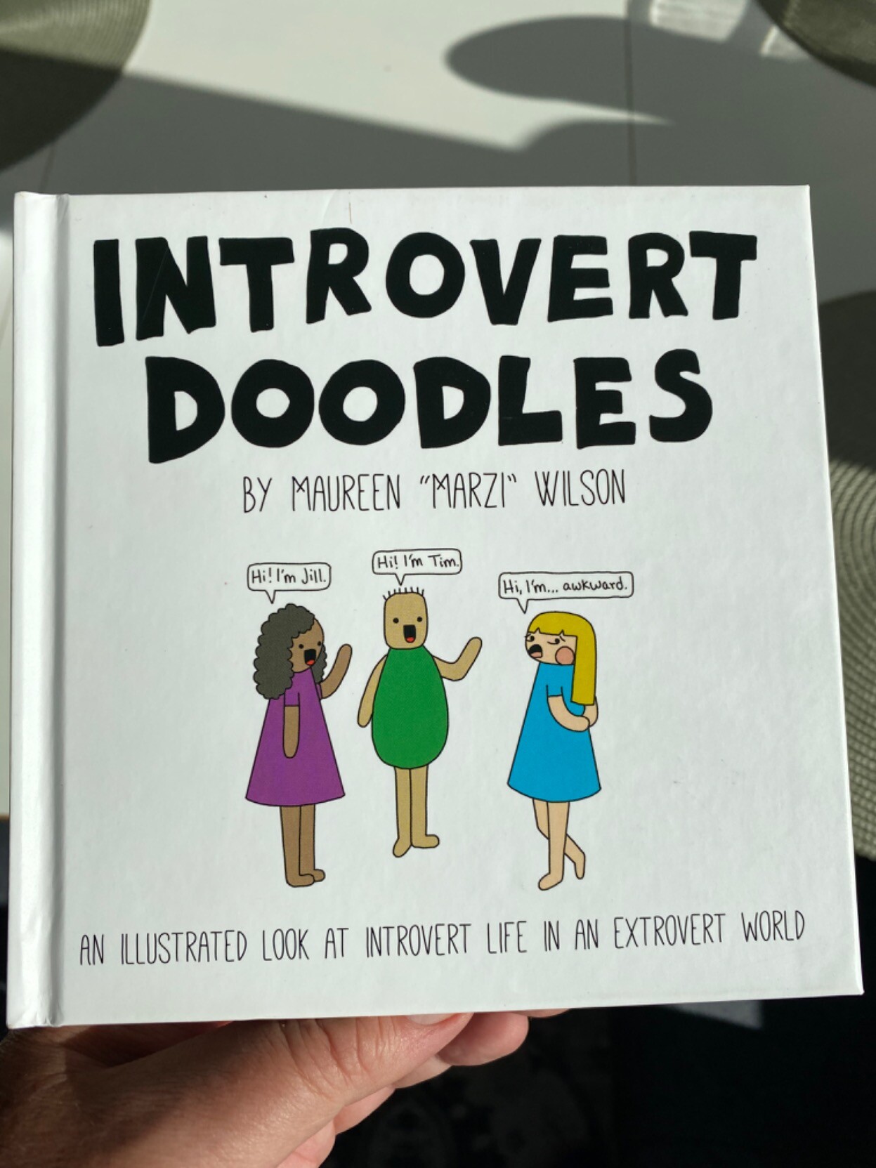 Book cover. Introvert Doodles by Maureen "Marzi" Wilson. An illustrated look at introvert life in an extrovert world.