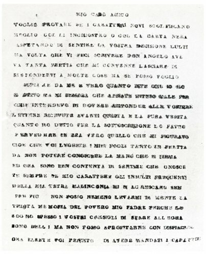 White paper with blurred typed letters, italian words. All capital letters.